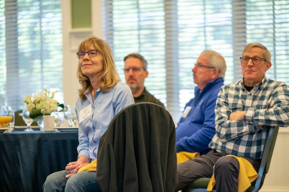 Alumni listening to the speaker.